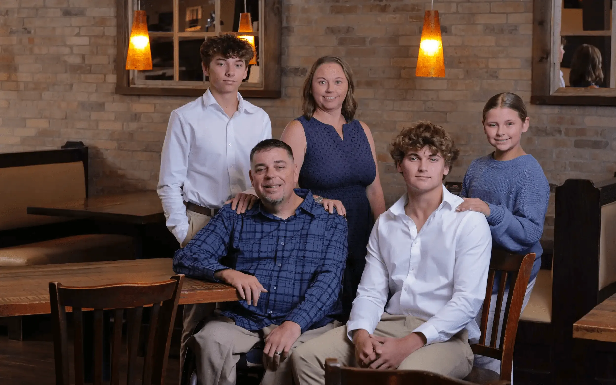 The Jimmy P's family together in a restaurant booth